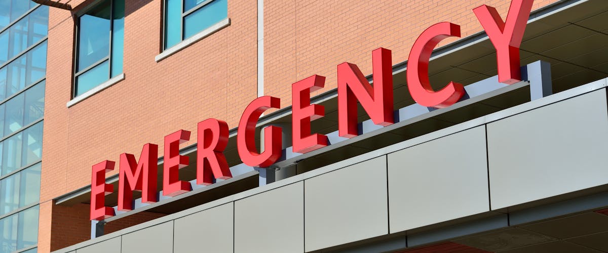 Empty corridor of a district hospital at night — placeholder